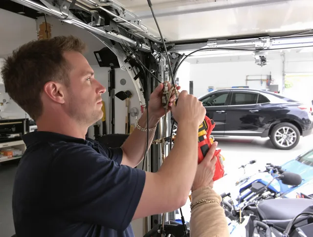 Maywood Garage Door Repair safety certified technician performing cable replacement in Maywood