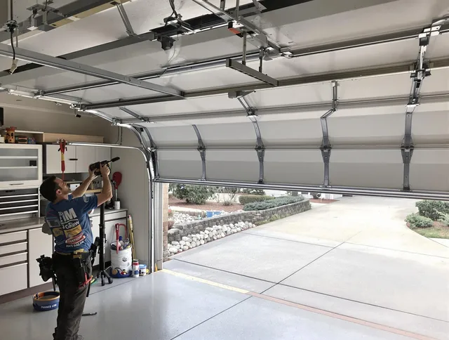 Garage door track repair service by Maywood Garage Door Repair in Maywood
